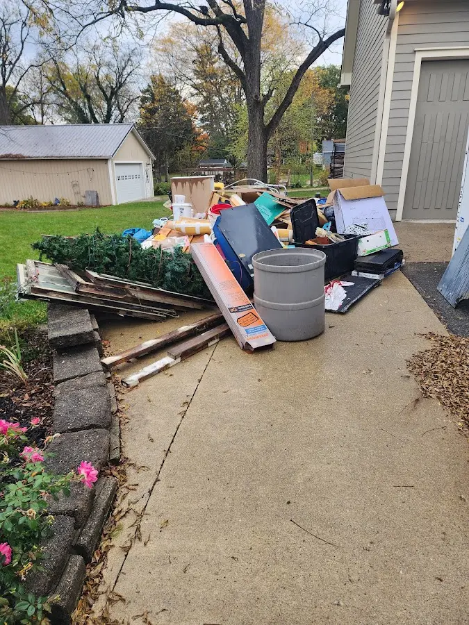 Dumpster being loaded with debris for Commercial Dumpster Rental in The Acreage